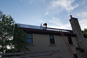 a home with solar panels on the roof